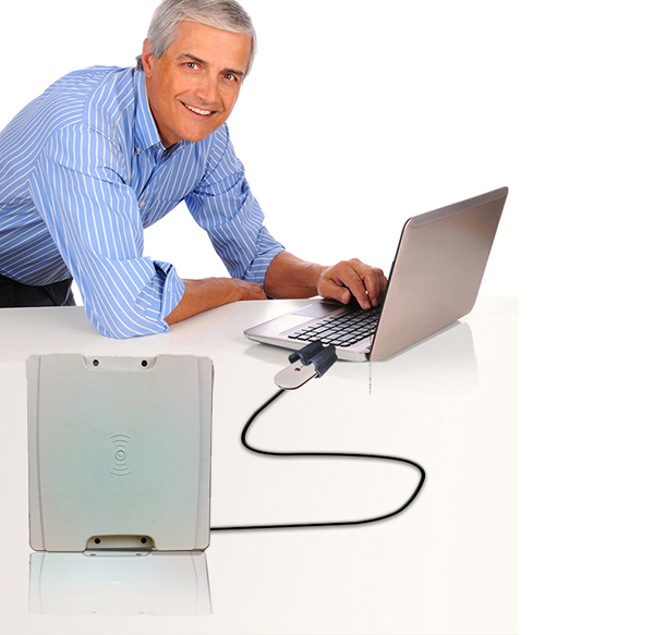 Middle Age Businessman at desk with Laptop