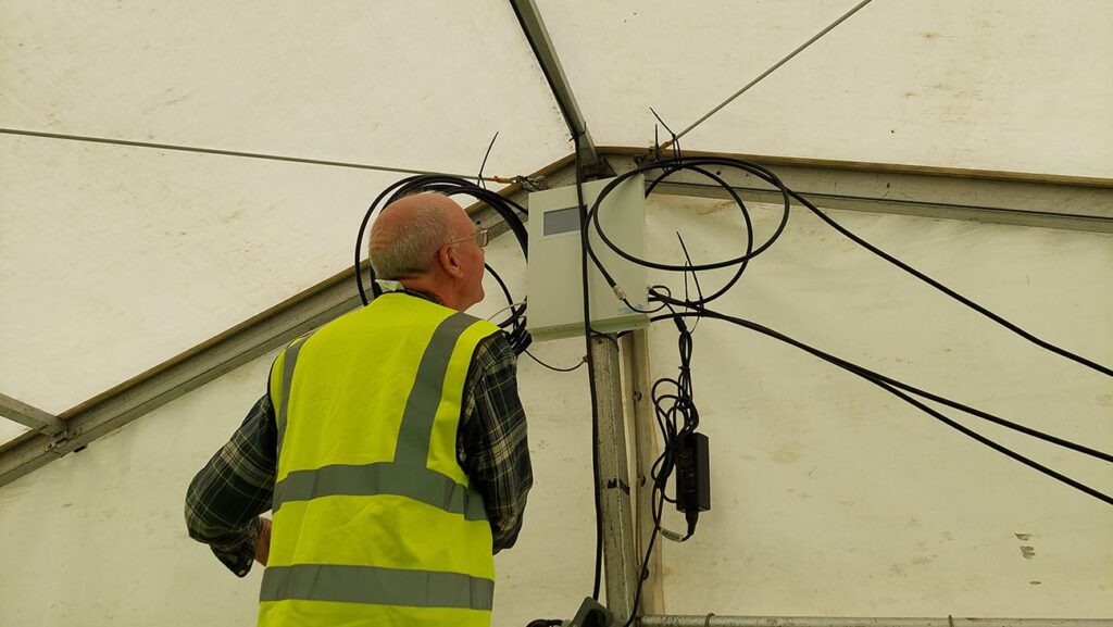 Stella Doradus mobile signal repeaters at an outdoor music festival.